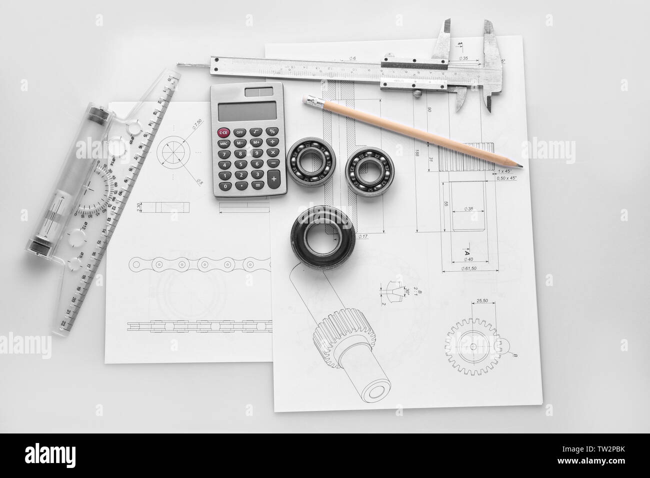 Engineering supplies and part blueprints on white background Stock