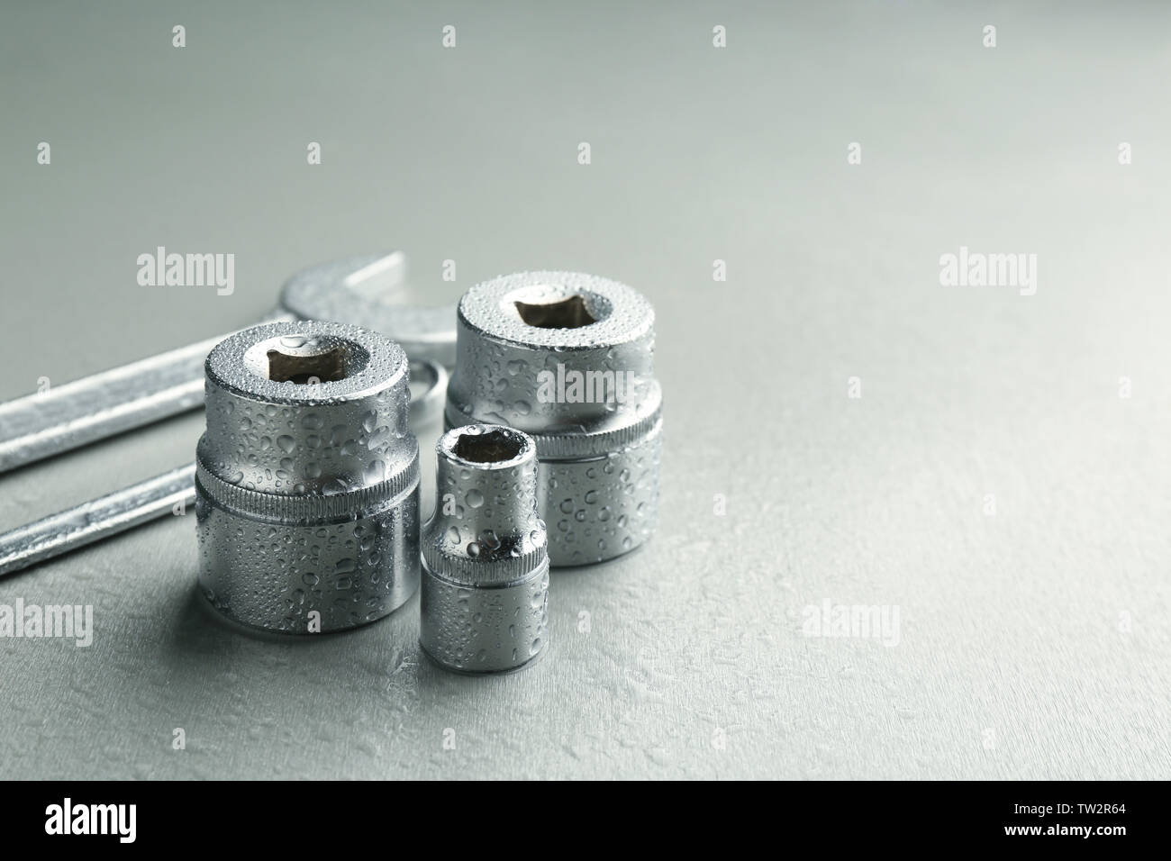 Hand sockets and spanners on light background Stock Photo