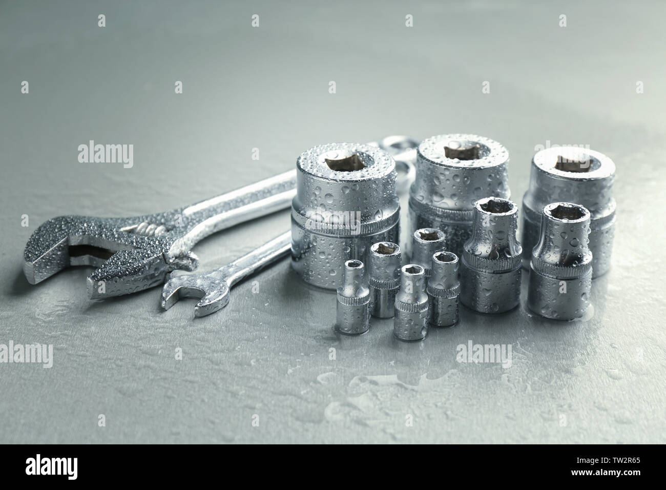 Hand sockets and spanners on light background Stock Photo