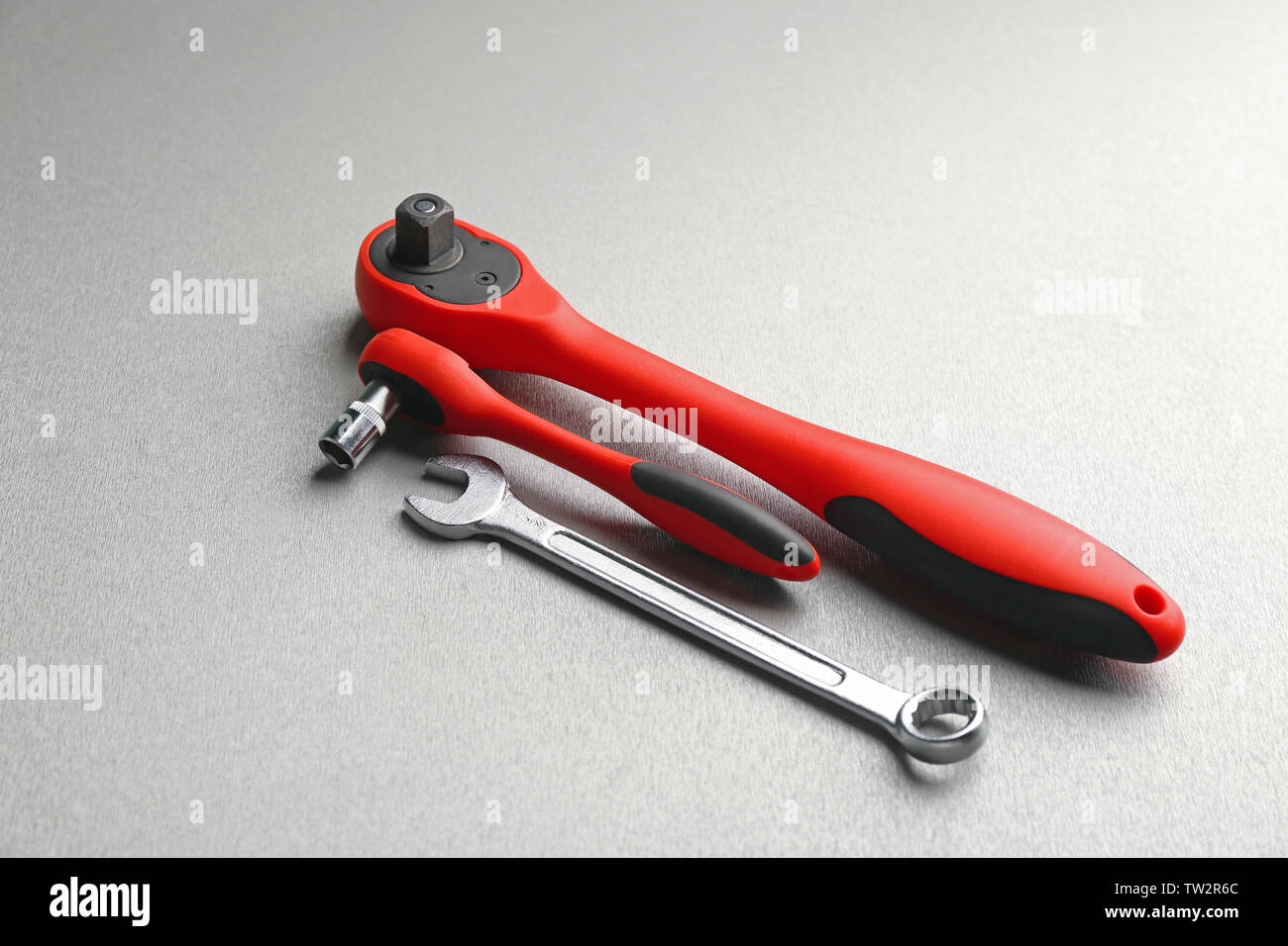 Ratchets and combination wrench on light background Stock Photo