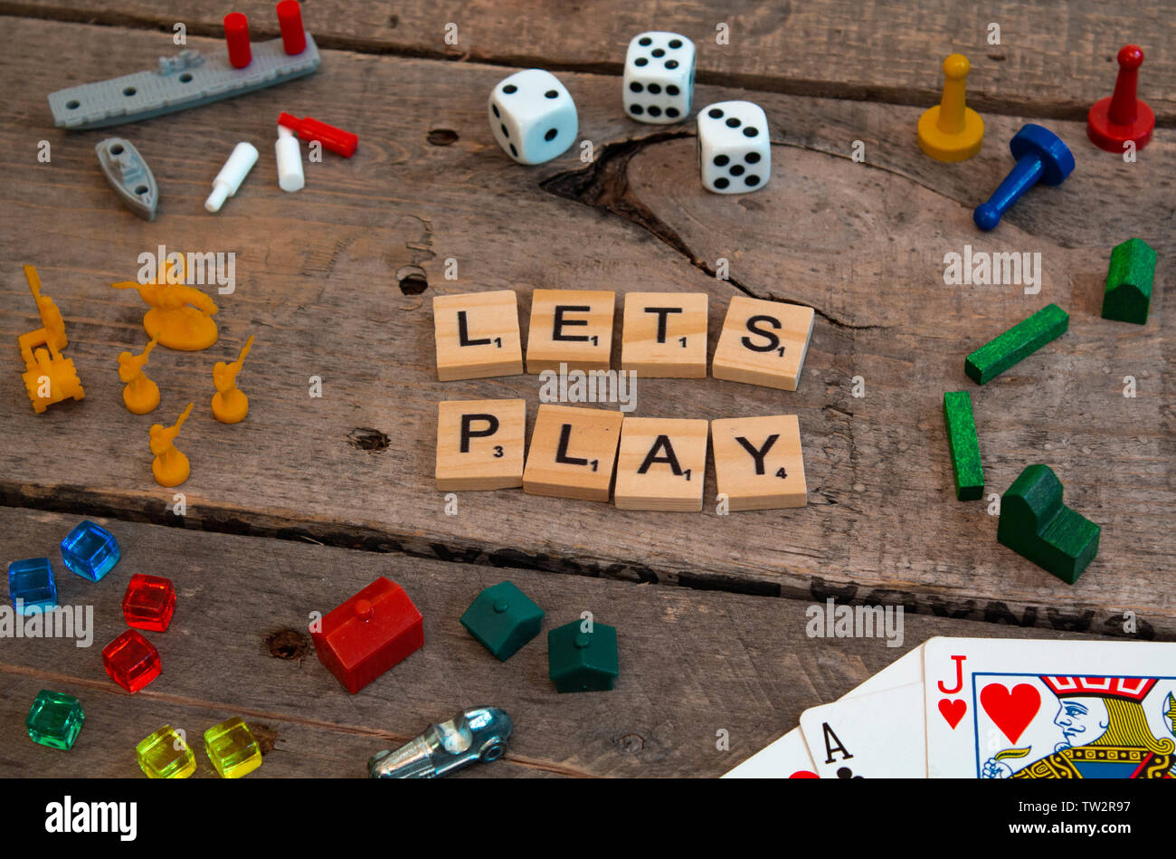 Lets Play" made from Scrabble game letters, Risk, Battleship pieces,  Monopoly, Settler of Catan and other game pieces Stock Photo - Alamy