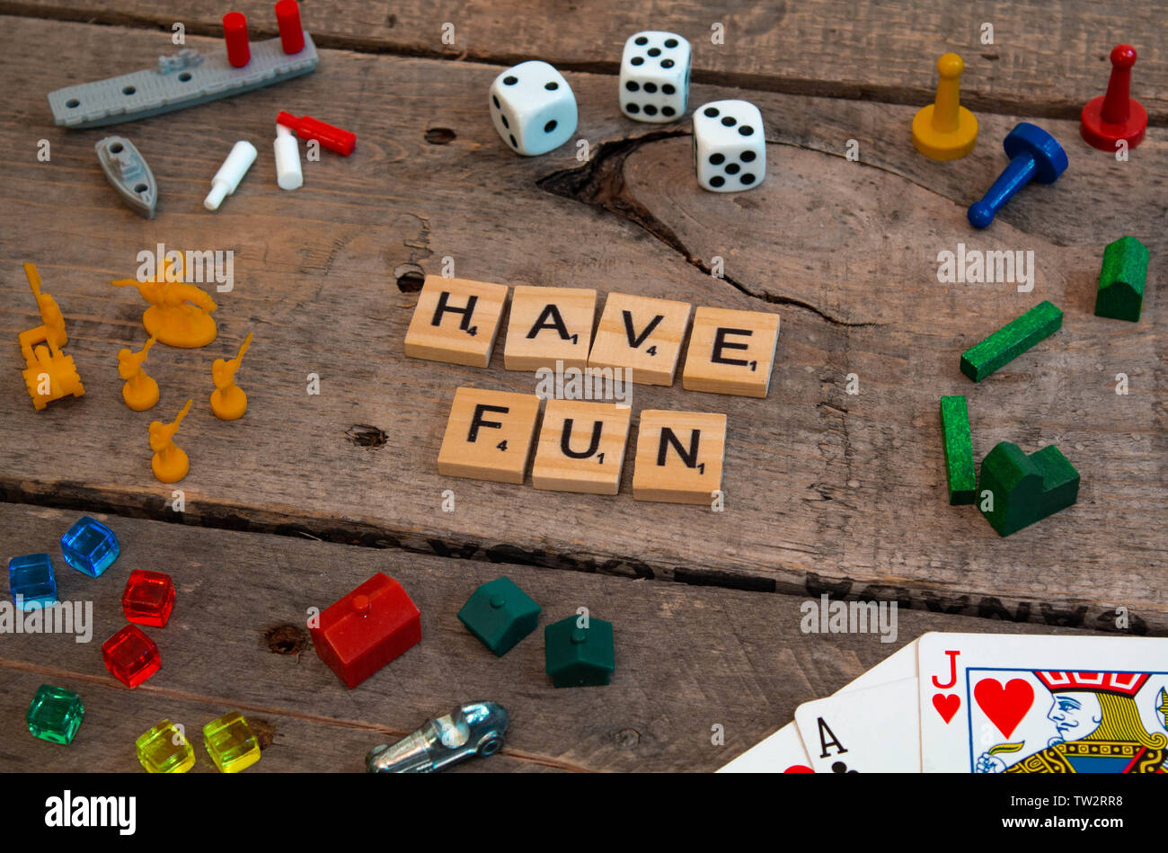 "Have Fun" made from Scrabble game letters, Risk, Battleship pieces, Monopoly, Settler of Catan and other game pieces Stock Photo