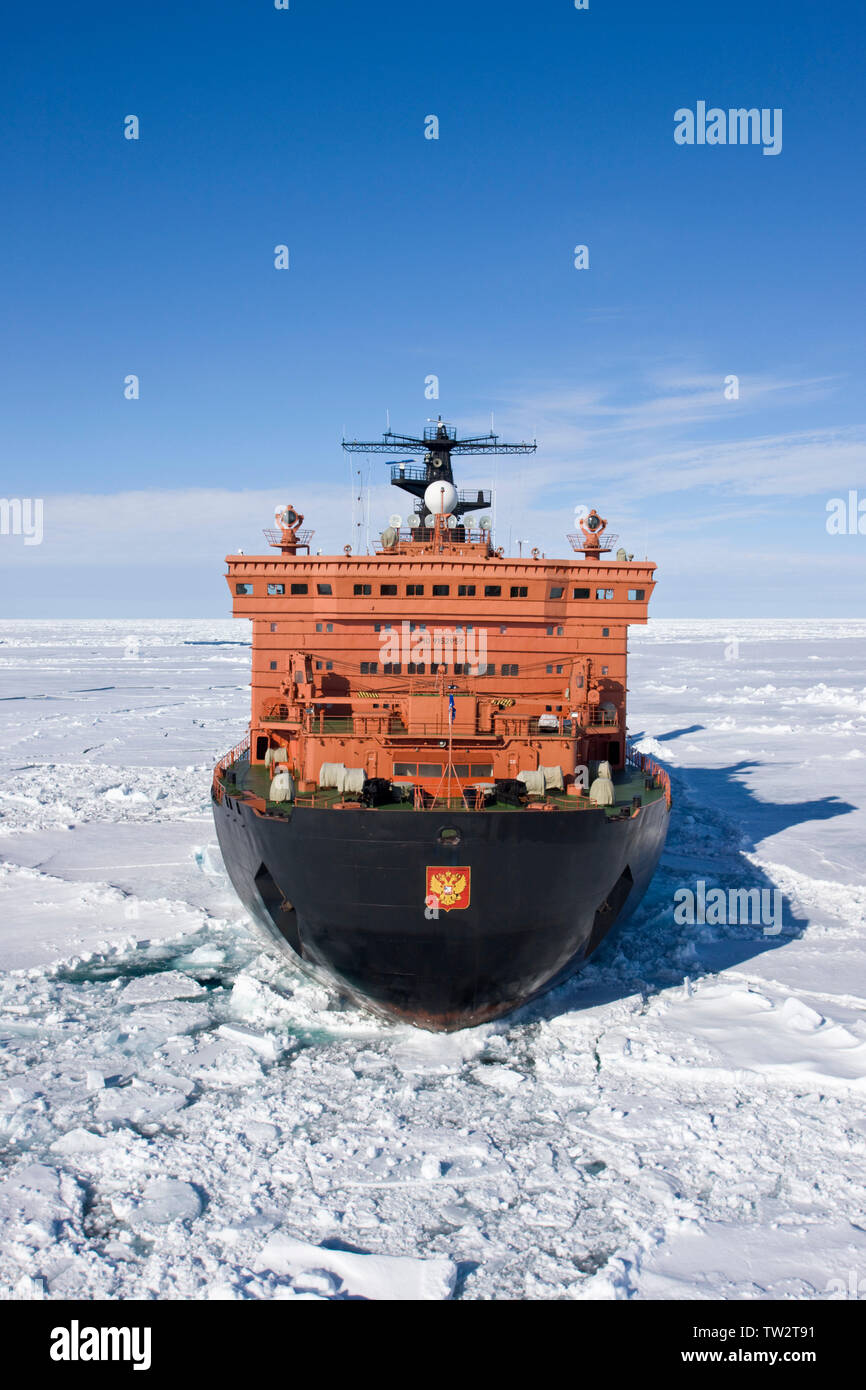 Aerial view of world's largest nuclear icebreaker, 50 years of Victory, an Arktika class vessel, en route to North Pole taking tourists to 90 degrees. Stock Photo