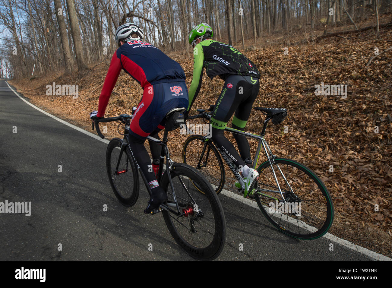 UNITED STATES - December 8, 2015: Pro cyclist Justin Mauch and Joe Dombrowski ride across Mt. Weather in the Blue Ridge Mountains of Virginia near Par Stock Photo