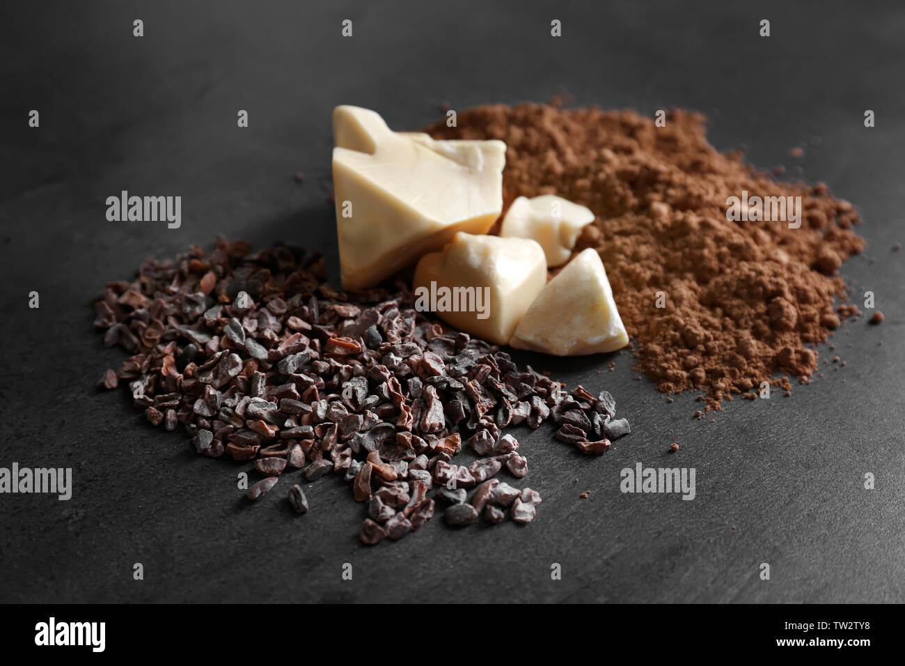 Cocoa nibs, butter and powder on gray background Stock Photo Alamy