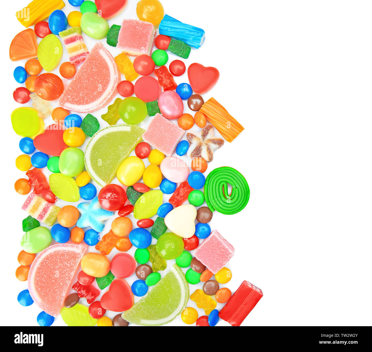 Tasty and colorful candies on white background Stock Photo - Alamy