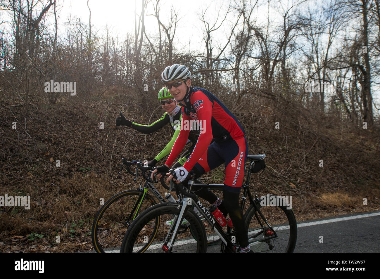 UNITED STATES - December 8, 2015: Pro cyclist Justin Mauch and Joe Dombrowski ride across Mt. Weather in the Blue Ridge Mountains of Virginia near Par Stock Photo