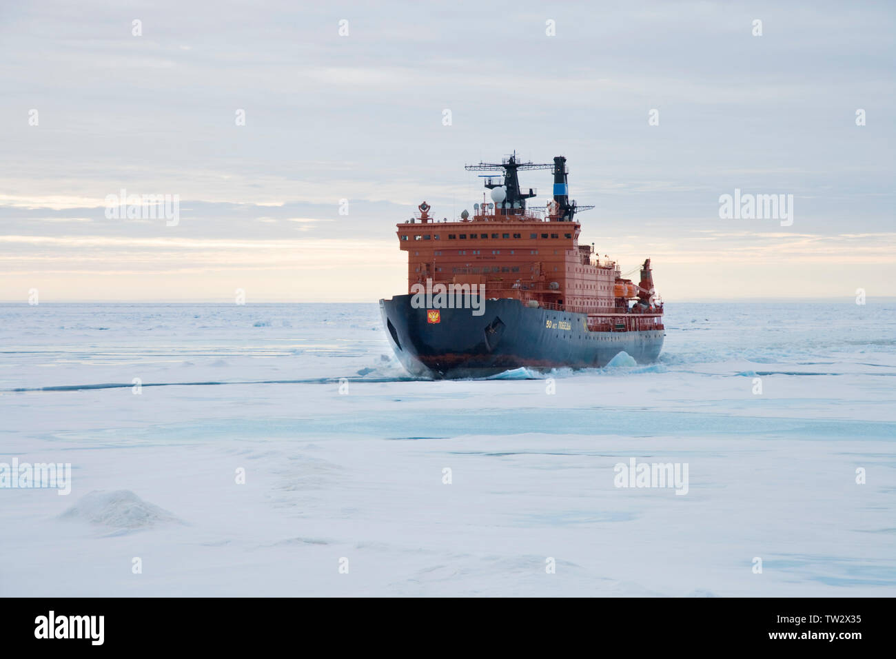 World's largest nuclear icebreaker, 50 Years of Victory, chartered by Quark Expeditions for trip to North Pole. Aerial view of ship in sea ice. Stock Photo