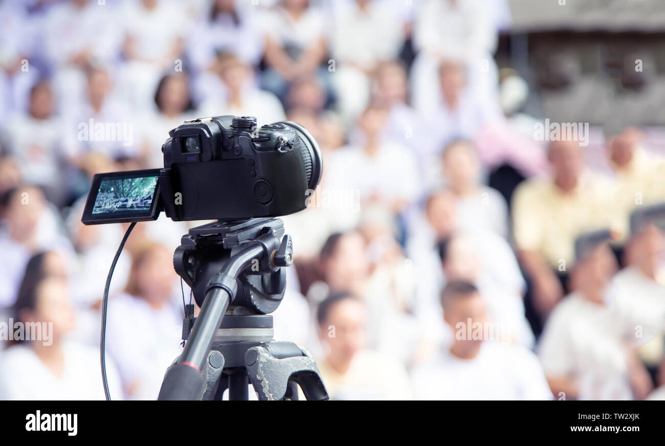 digital camera record video interview or news media production with blur  people on background Stock Photo - Alamy