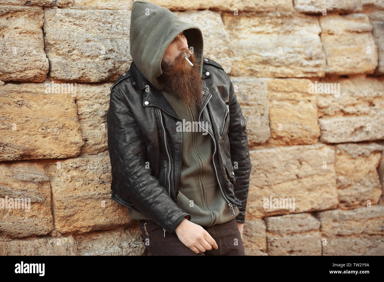Bearded man smoking weed outdoors Stock Photo Alamy