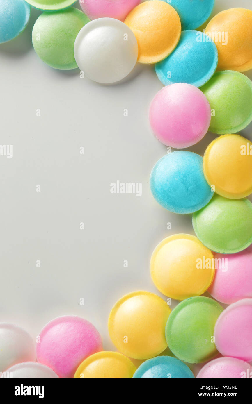 Frame made of tasty colorful candies on white background Stock Photo ...