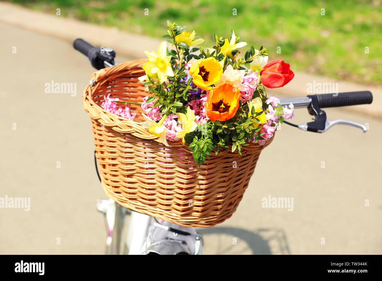 Bicycle With Beautiful Basket Of Flowers On Blurred Background Stock Photo Alamy