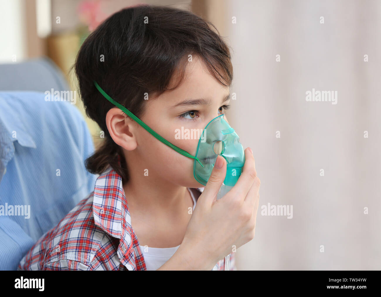 Boy using asthma machine at home Stock Photo Alamy