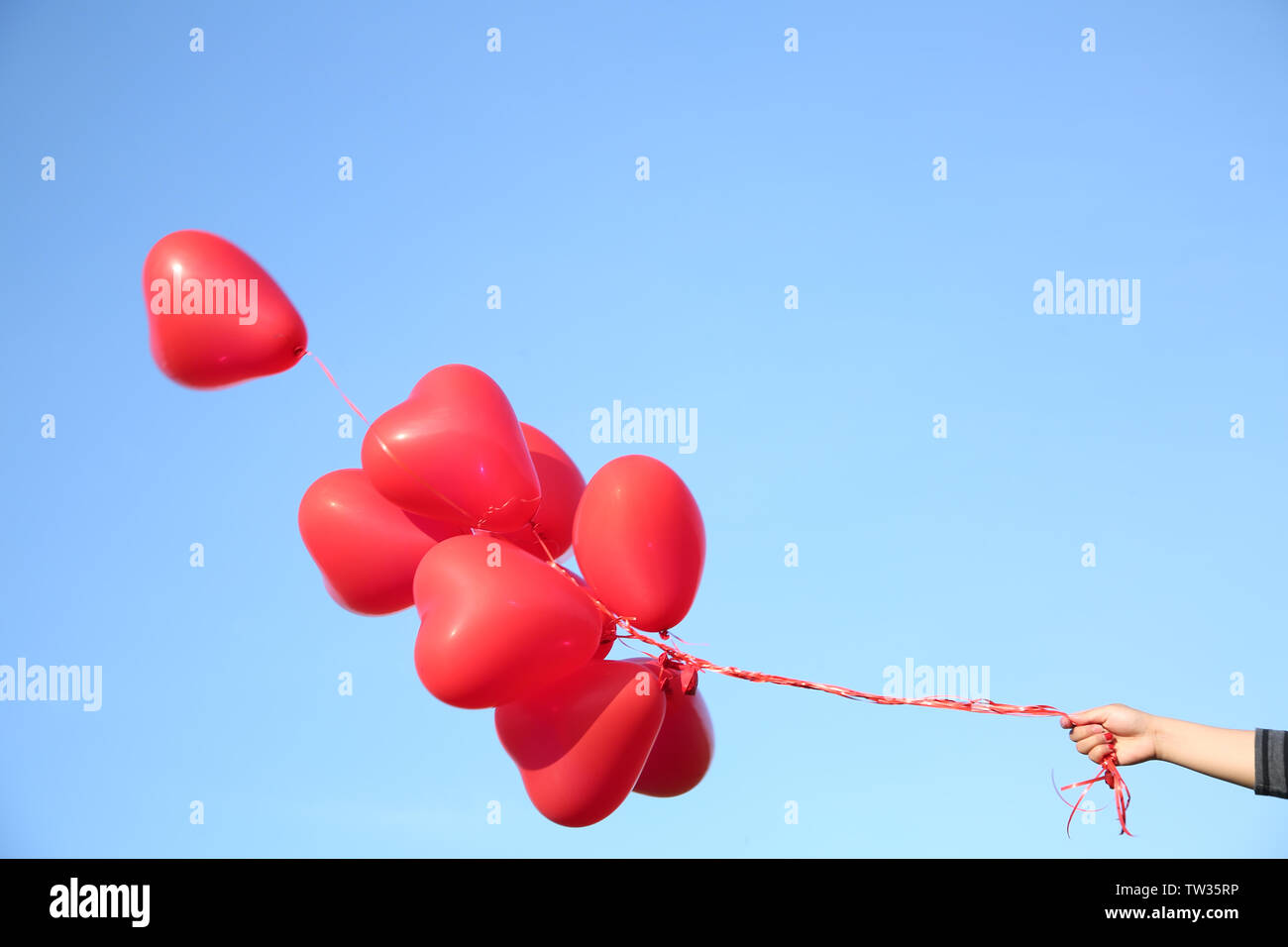 Holding Red Balloon Stock Photo - Download Image Now - Balloon, Stick -  Plant Part, Human Hand - iStock
