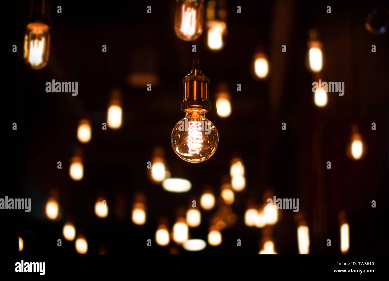 classic tunsten bulb deciration in dark room. Illumination shining