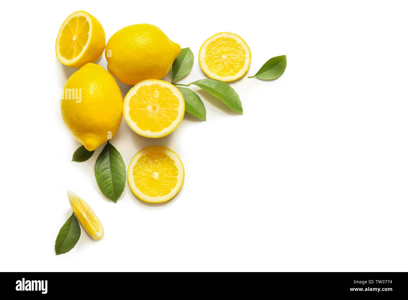 Composition of delicious citrus fruit and green leaves on white ...