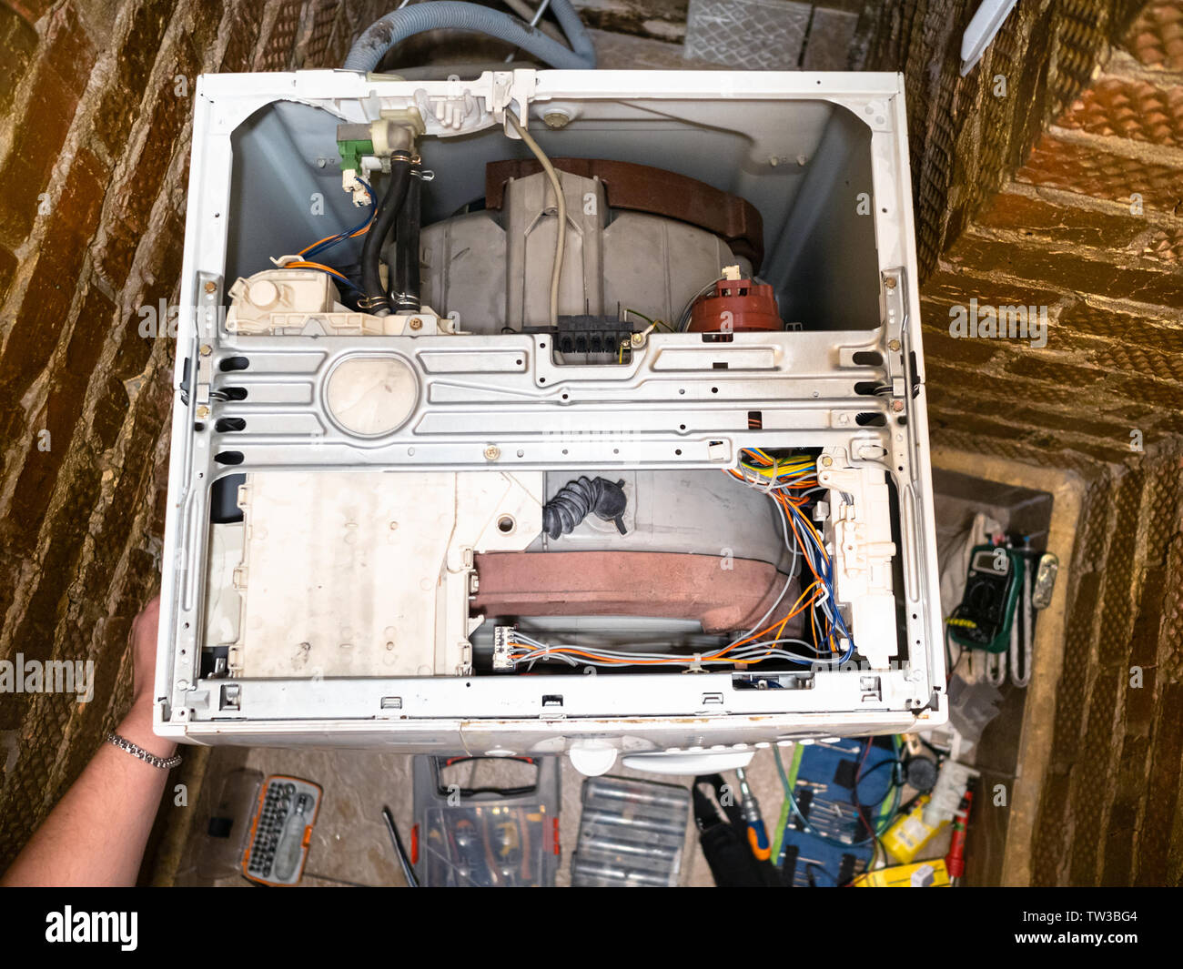 top view of disassembling an old washing machine at home Stock Photo