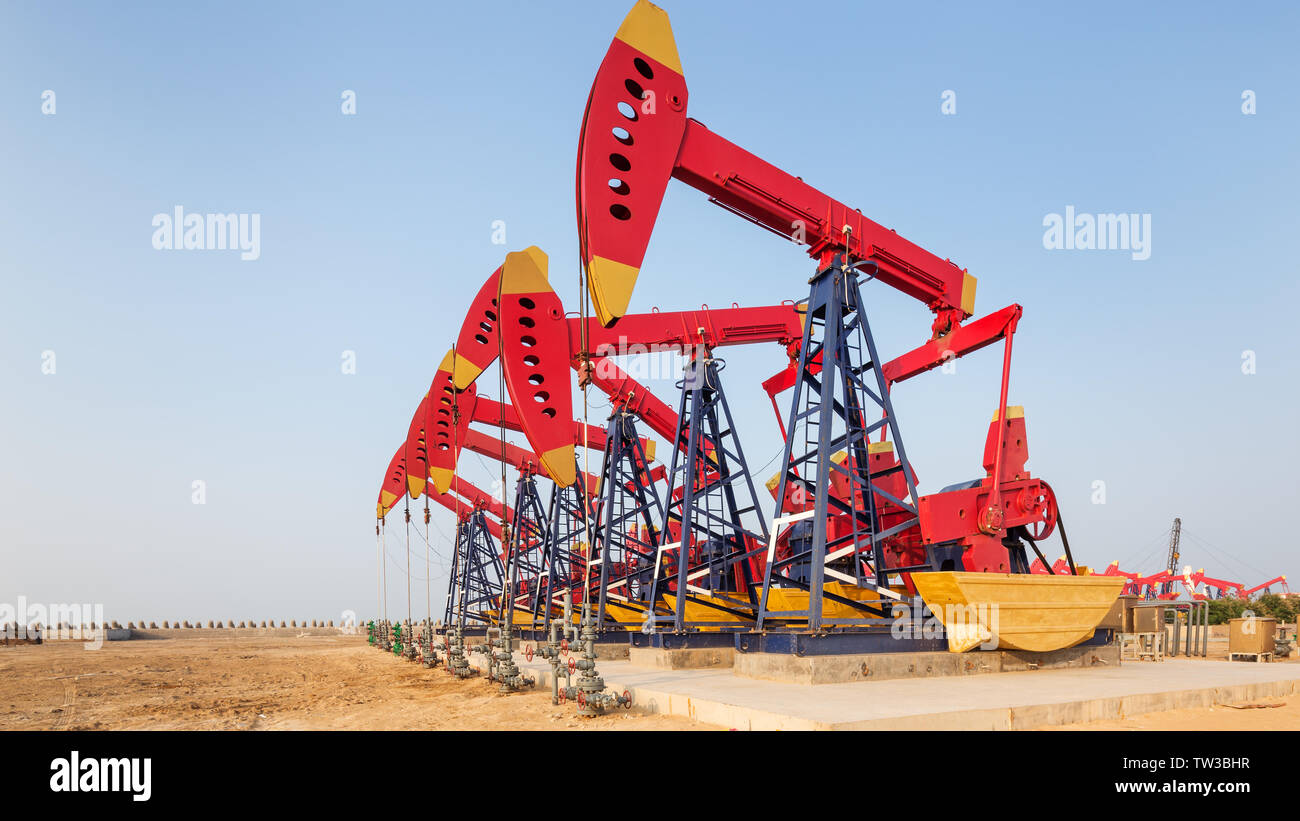 landscape of oilfield with pump units in blue sky Stock Photo - Alamy