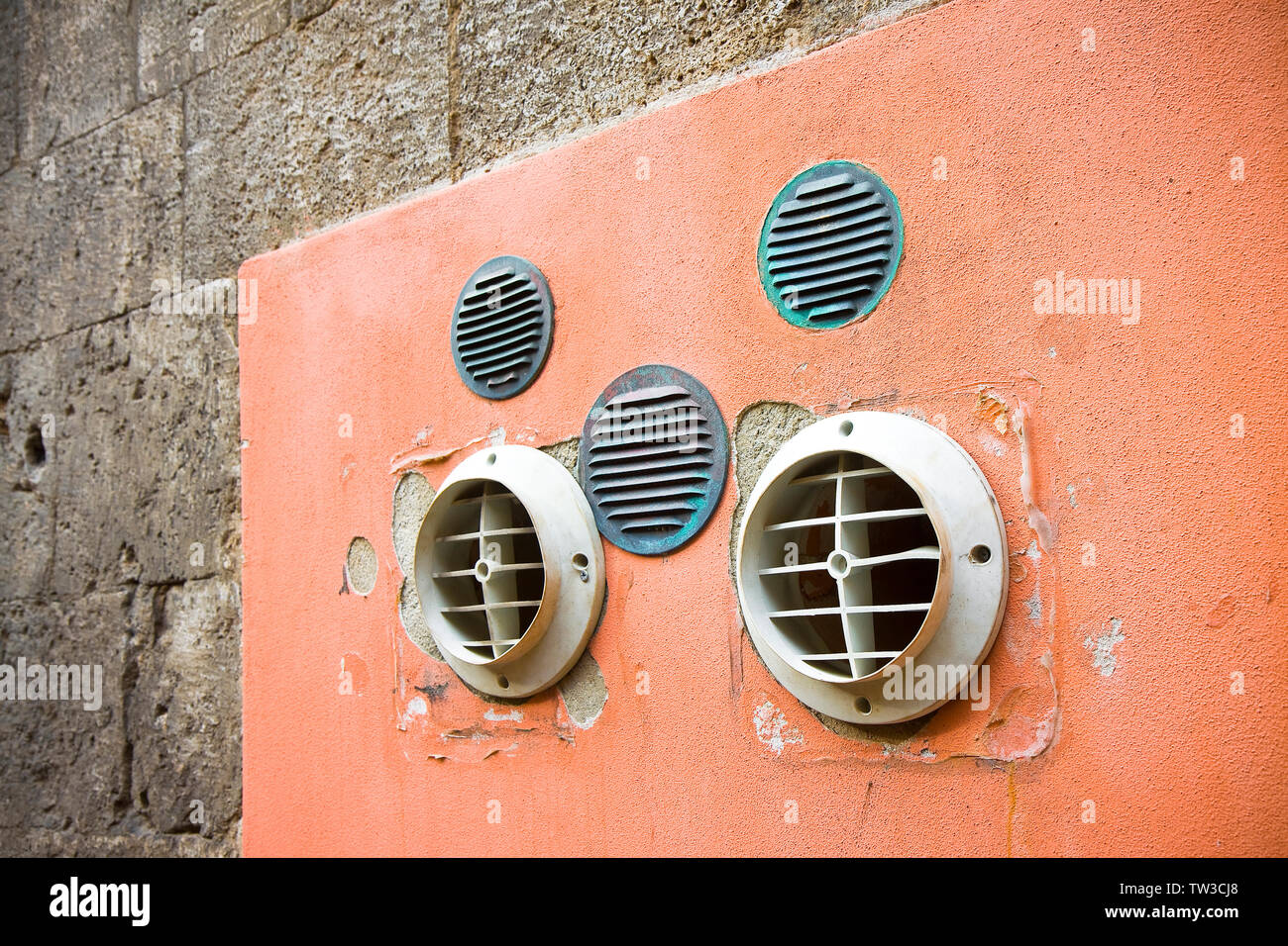 Venting on colored plaster wall with copy space Stock Photo