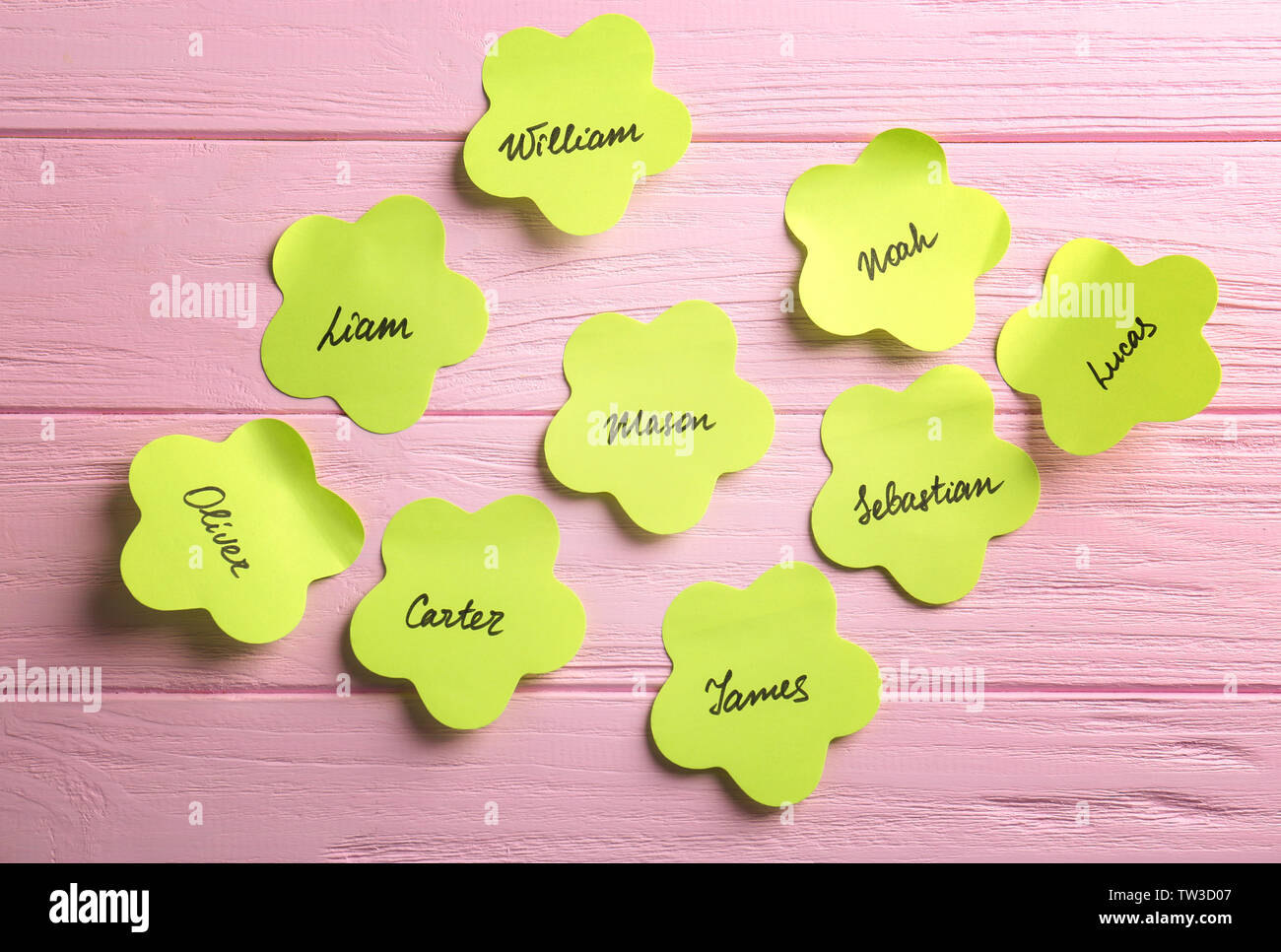 paper-stickers-with-different-names-on-wooden-background-concept-of