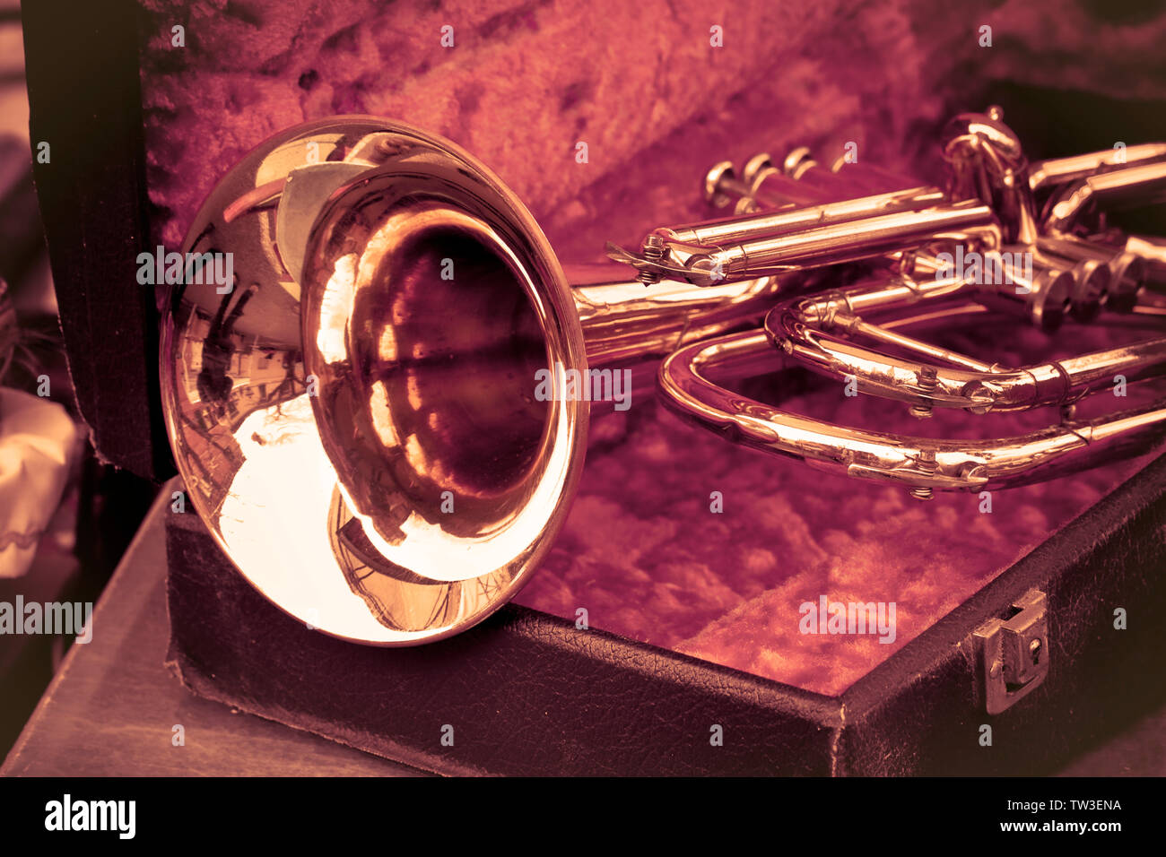 Old trumpet exposed in an italian flea market toned image Stock Photo