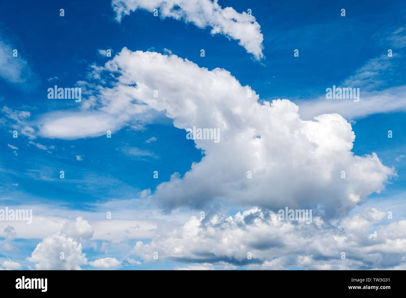 Unusual cloud formations against clear cobalt blue sky; central Colorado, USA Stock Photo