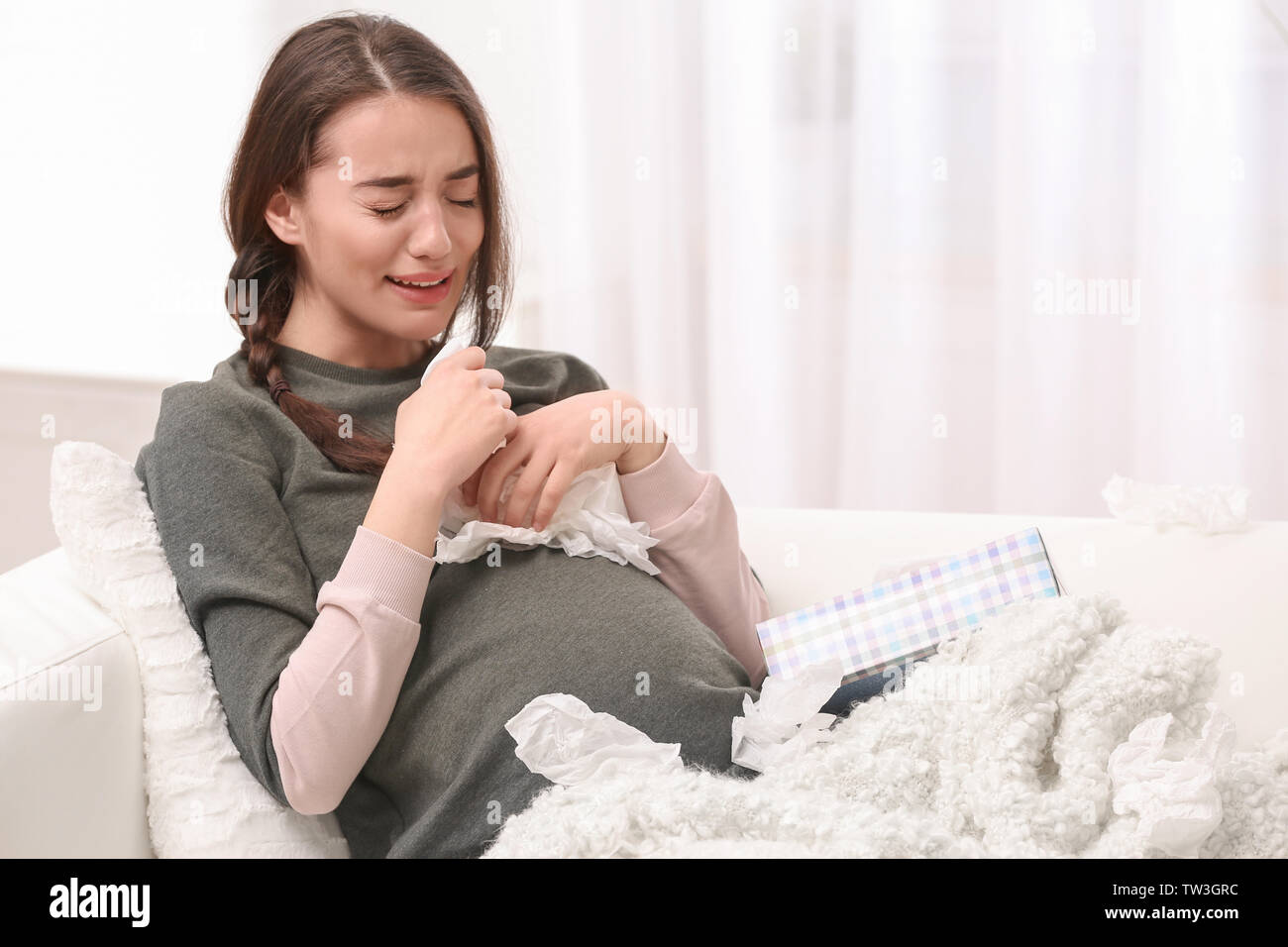 Young pregnant woman crying at home Stock Photo Alamy