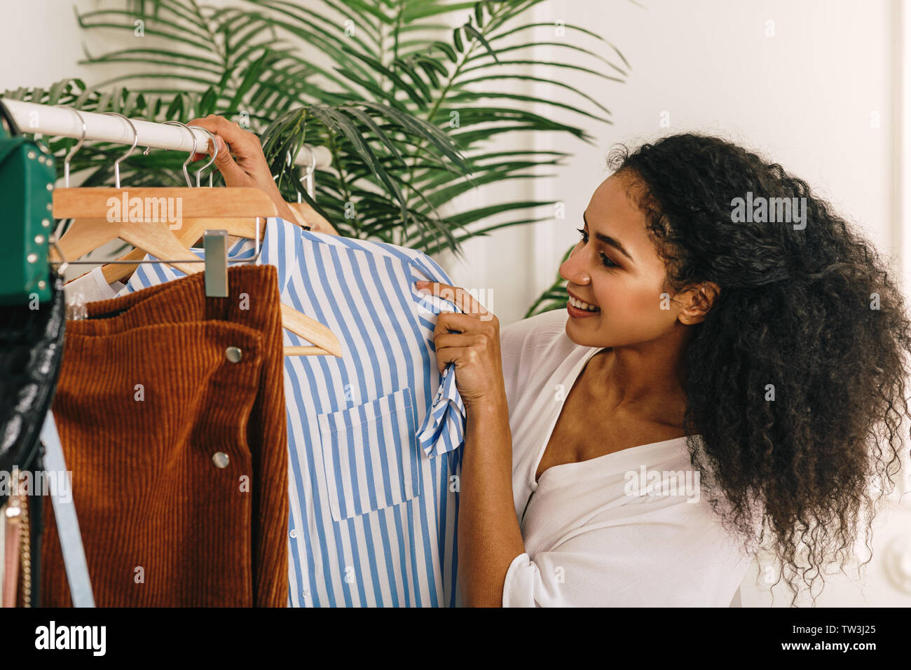 Da Wa, a post-90s fashion designer, poses for photos with her vintage  clothes to be sold on Alibaba's e-commerce platform Taobao at home  decorated wit Stock Photo - Alamy