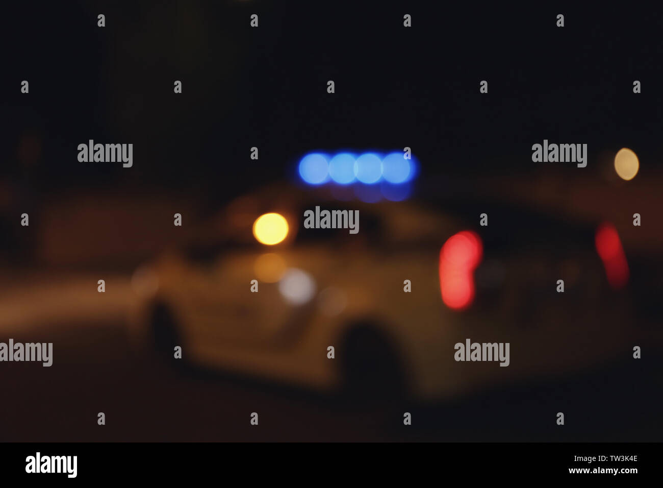 Blurred view of police car on road at night Stock Photo - Alamy