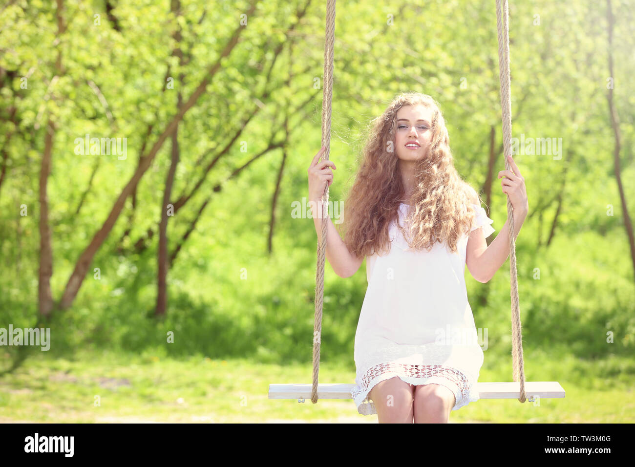 Woman alone spring swing hi-res stock photography and images - Alamy