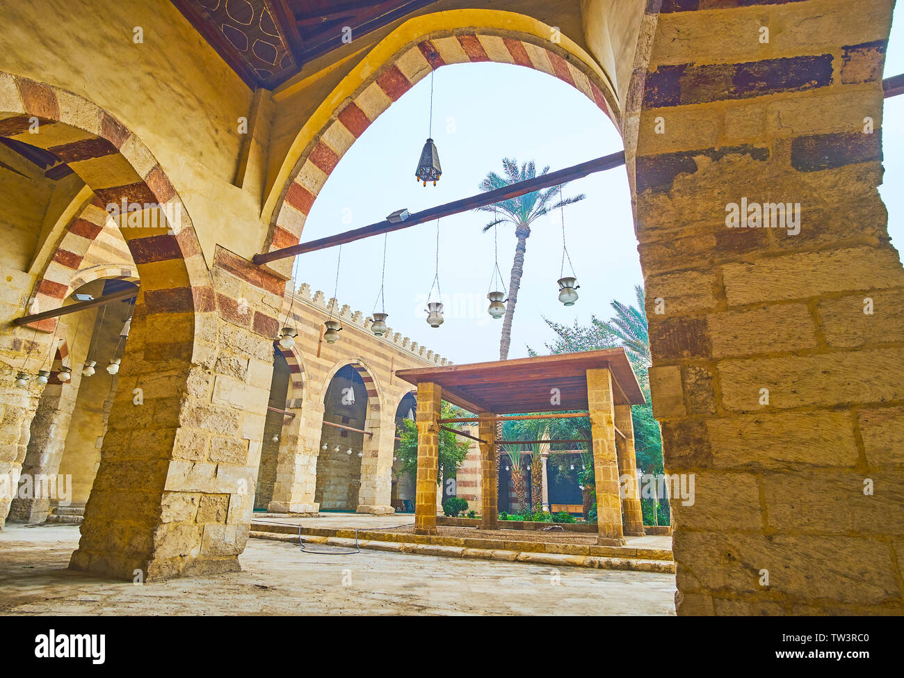 CAIRO, EGYPT - DECEMBER 22, 2017: Walk along the arcade of Aqsunqur (Blue) Mosque and enjoy its garden, located in courtyard, on December 22 in Cairo Stock Photo