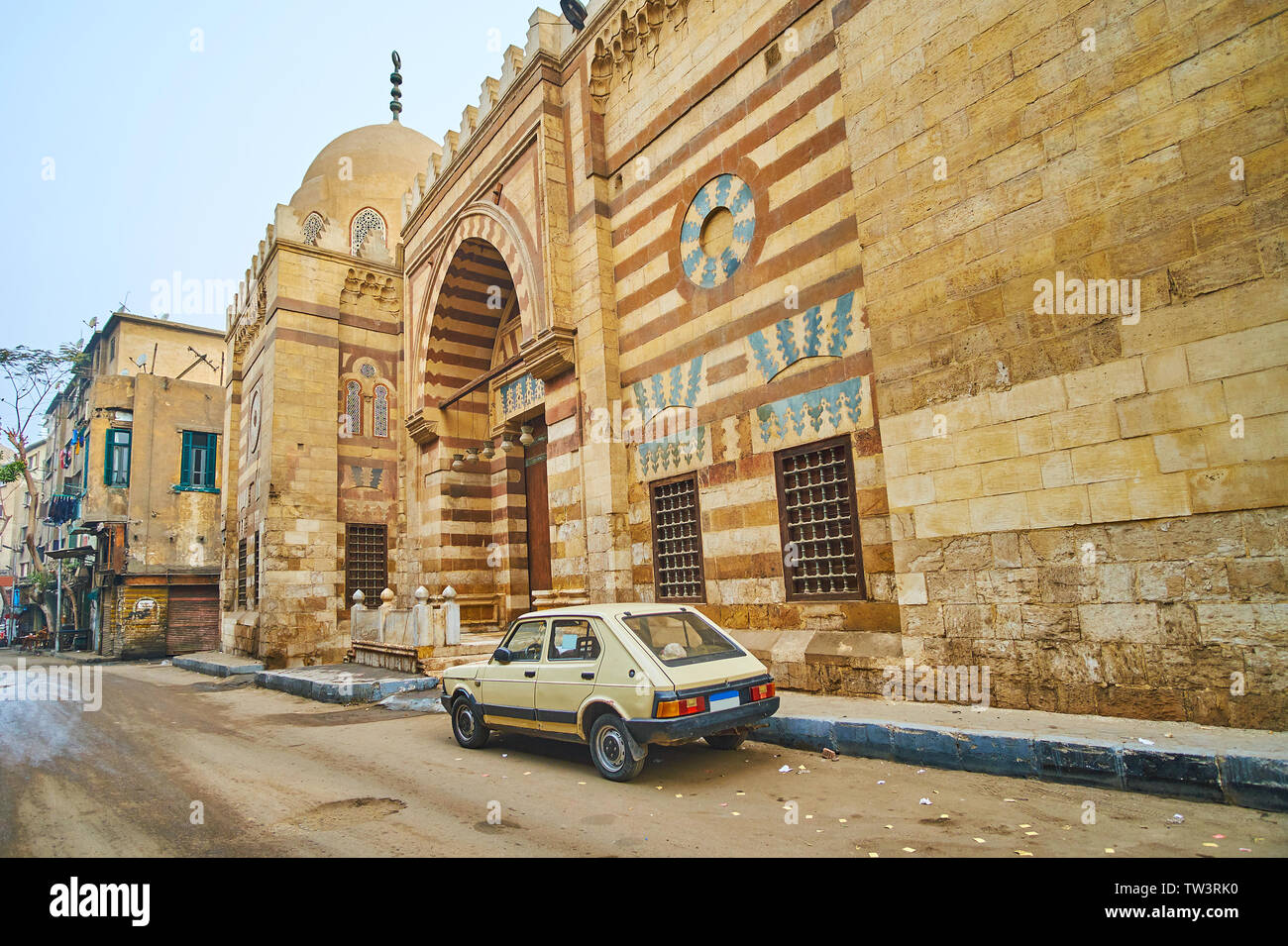 The stone wall of Amir Khayrbak Funerary Complex with carvings and relief patterns, located in Al Wazir street, Cairo, Egypt Stock Photo