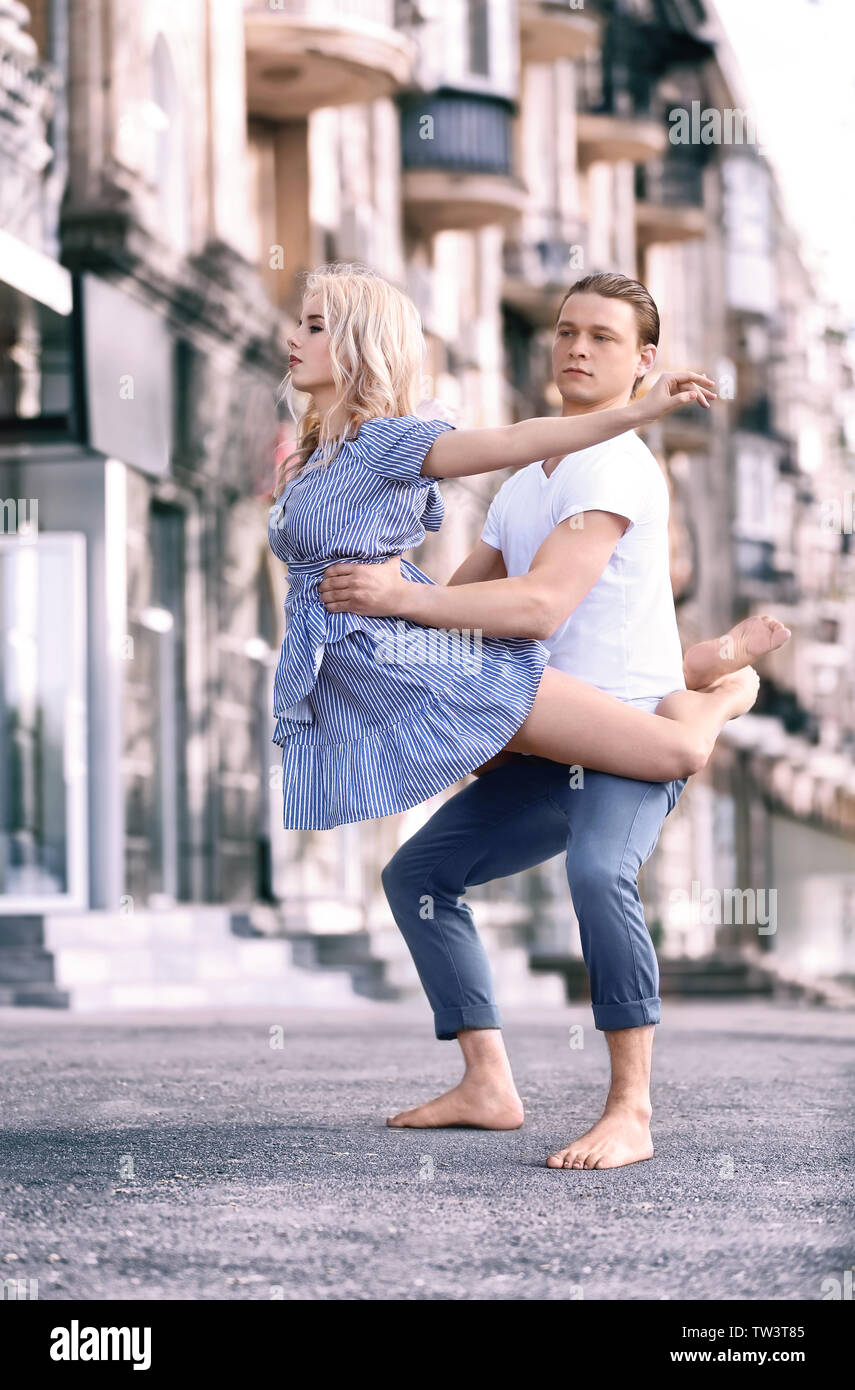 Passionate couple dancing outdoors Stock Photo