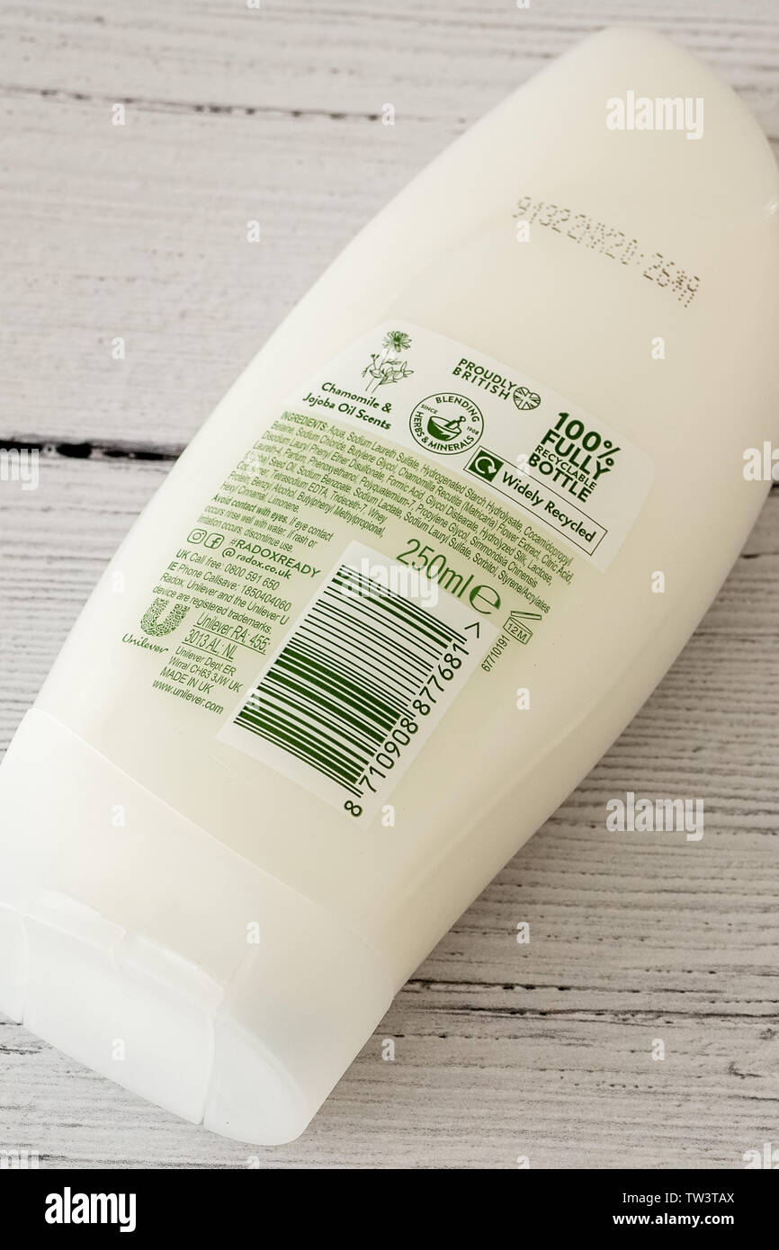 Largs, Scotland, UK - June 06, 2019: Rear view of Radox branded moisturise cream in a plastic recyclable bottle and cap in line with UK recycling guid Stock Photo