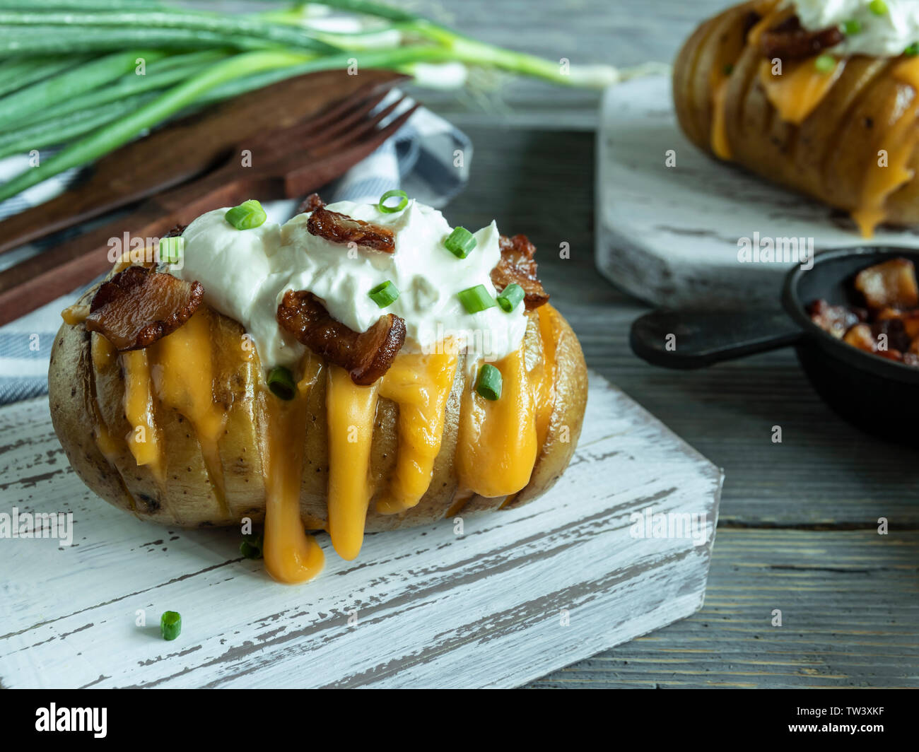 baked potato stuffed with cheese, bacon and sour cream. loaded