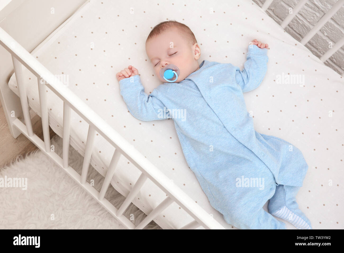 baby sleeping in cradle