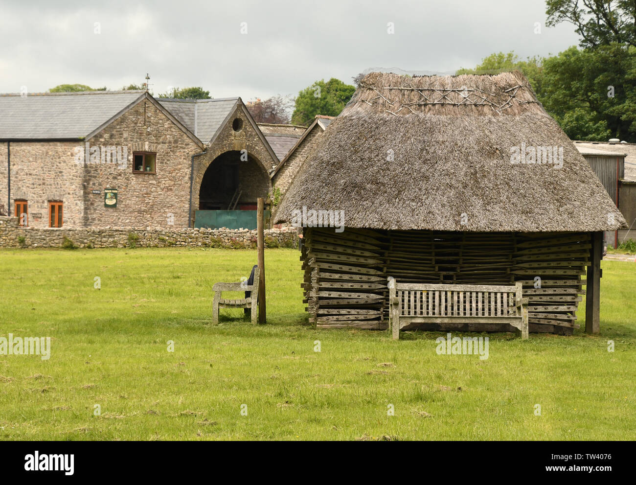 The thatched stack of Hurdles on the village green at Priddy in Somerset. The ash hurdles were originally used to pen the sheep, for which the Mendip Stock Photo