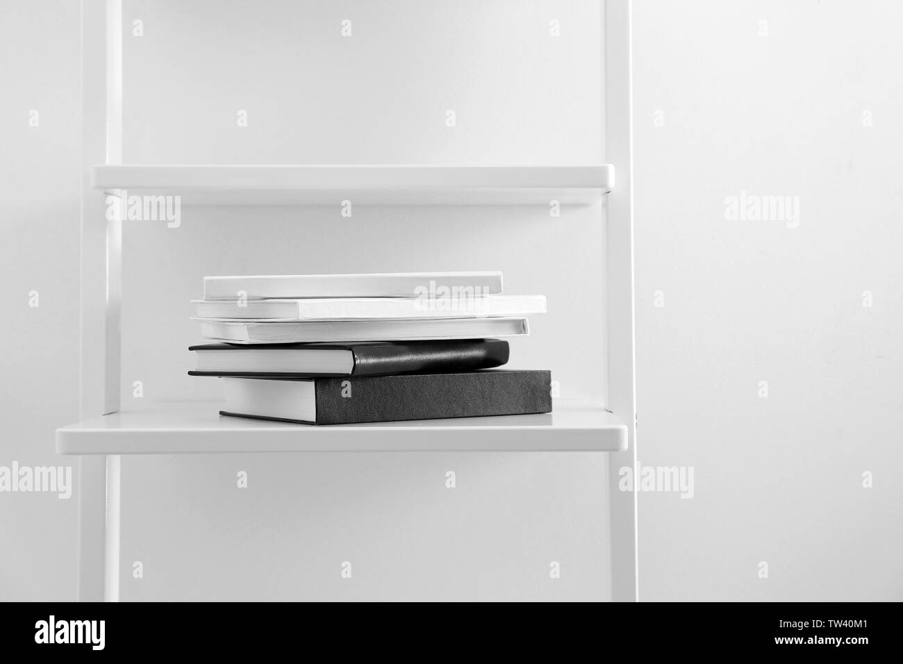 Stack of books on shelf Stock Photo Alamy