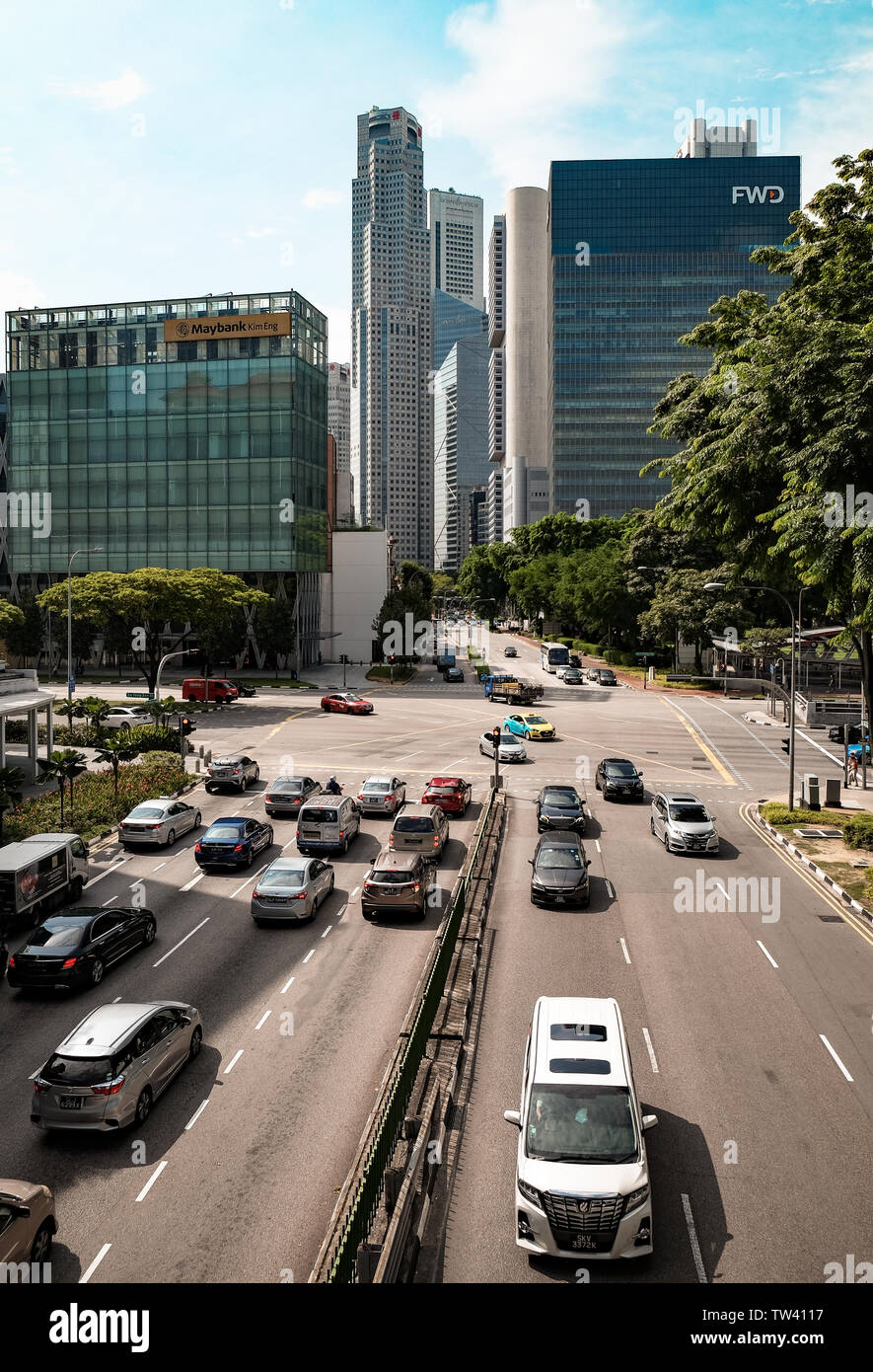 A raised cityscape view looking from Merchant road Singapore towards a busy traffic box junction with skyscrapers of the financial district Boat Quay Stock Photo