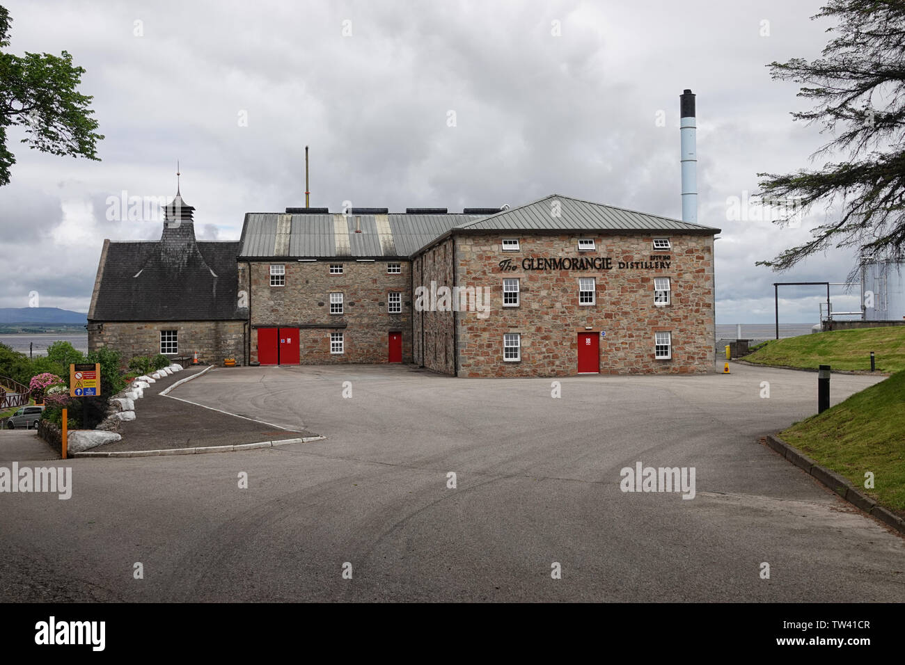 Tain, Scotland - June 11, 2019: The front exterior of Glenmorangie Distillery, founded in 1843 and located in the Scottish Highlands, is shown. Stock Photo