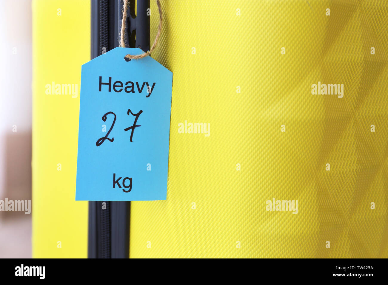 Tag on heavy suitcase. Luggage overweight concept Stock Photo Alamy