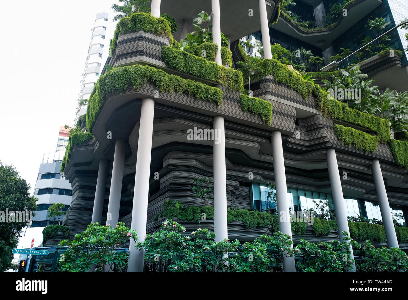 Park Royal hotel in Singapore is an eco-friendly design which consists of terraced gardens helping the building conform to less air pollution. Stock Photo