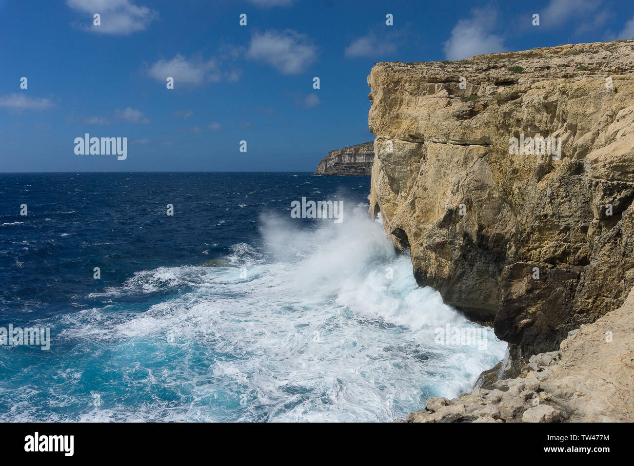 a coast with rough seas the Blue Hole in San Lawrenz on Gozo , azure window Stock Photo