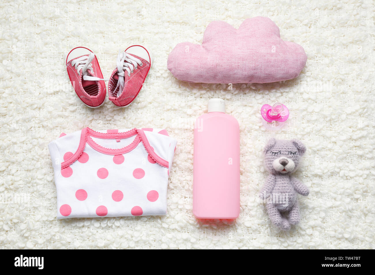 Cute baby accessories on white fluffy fabric background Stock Photo Alamy
