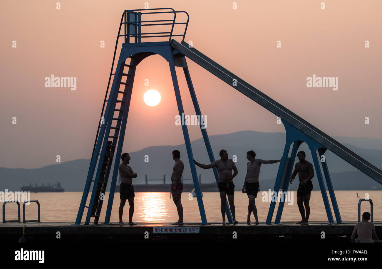 Silhouette of sunset by the sea Stock Photo - Alamy