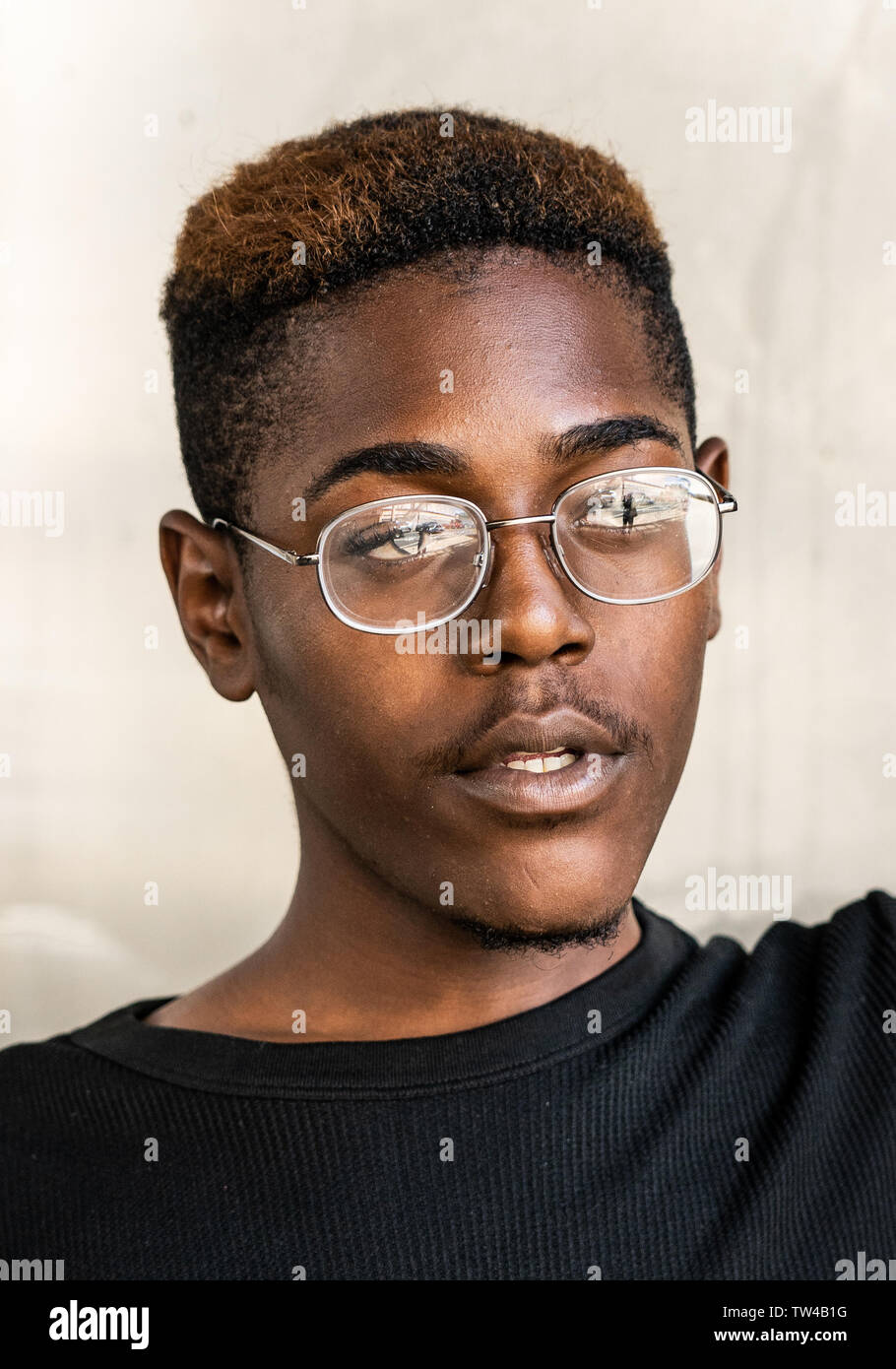 Philadelpia street portrait taken in the inner city of a  young African American man Stock Photo
