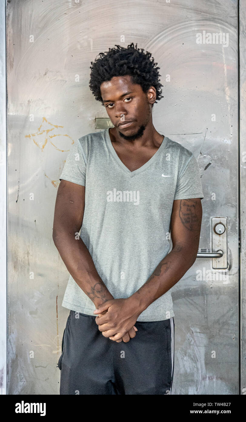 Philadelpia street portrait taken in the inner city of a  young African American man Stock Photo