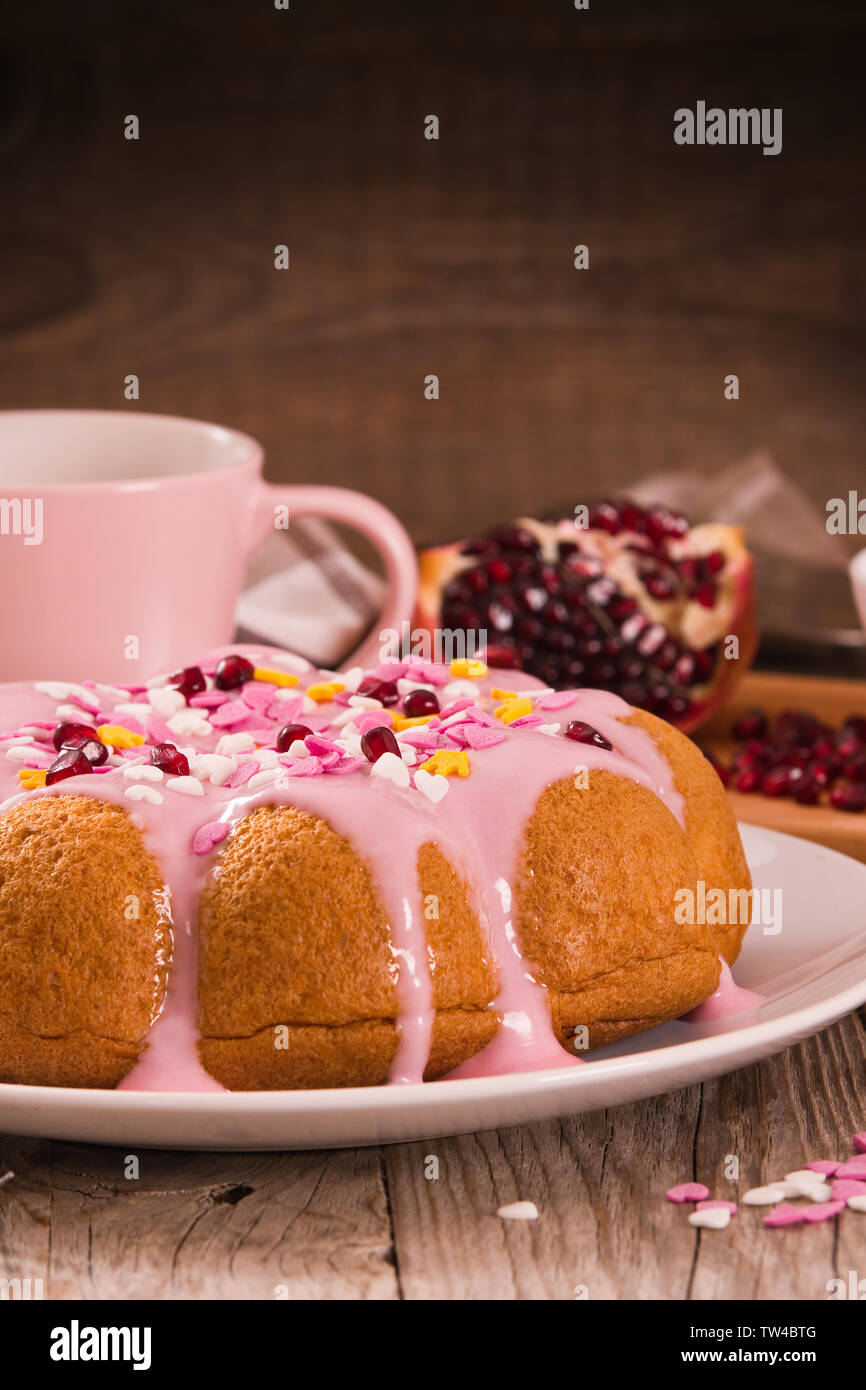 Cake with pink frosting Stock Photo - Alamy