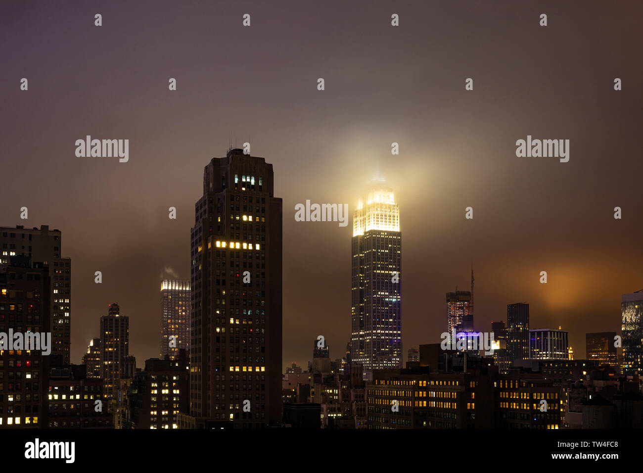 New York, USA. May 5th, 2019. City skyline at night. Aerial view of Manhattan skyscrapers and Empire state building, illuminated Stock Photo