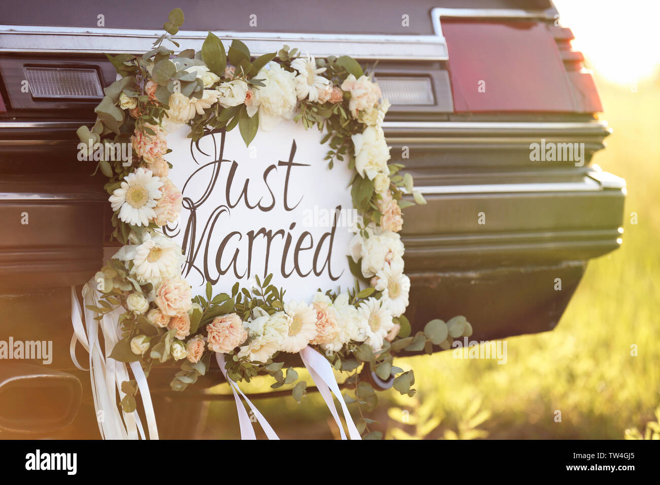 Beautiful wedding car with plate JUST MARRIED outdoors Stock Photo - Alamy